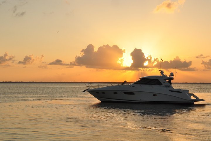 boat-rental-marina-sunrise-cancun Boat rental Marina Sunrise Cancun yacht cruising in calm lagoon water