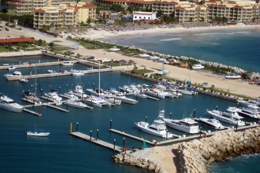 boat-rental-port-marina-cancun Boat rental Port Marina Cancun yacht cruising in clear blue water